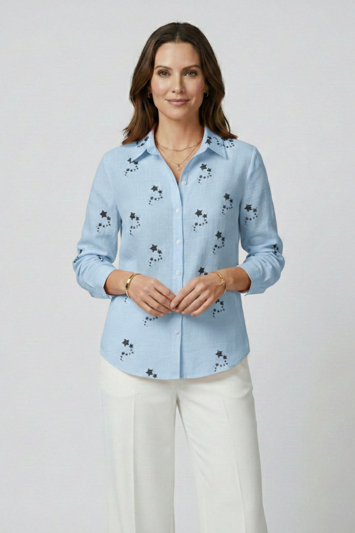 Women’s blouse with button front and floral print, featuring long sleeves and a round neckline for everyday and work styling.