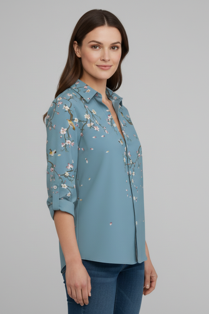 Women’s blouse with collared neckline and floral print, featuring long sleeves and button closure for everyday and work styling.