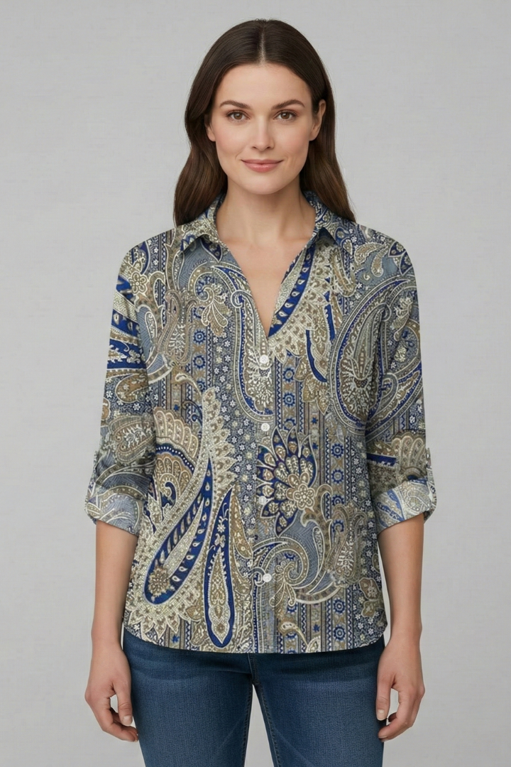 Women’s blouse with collared neckline and floral print, featuring long sleeves and button closure for everyday and work styling.