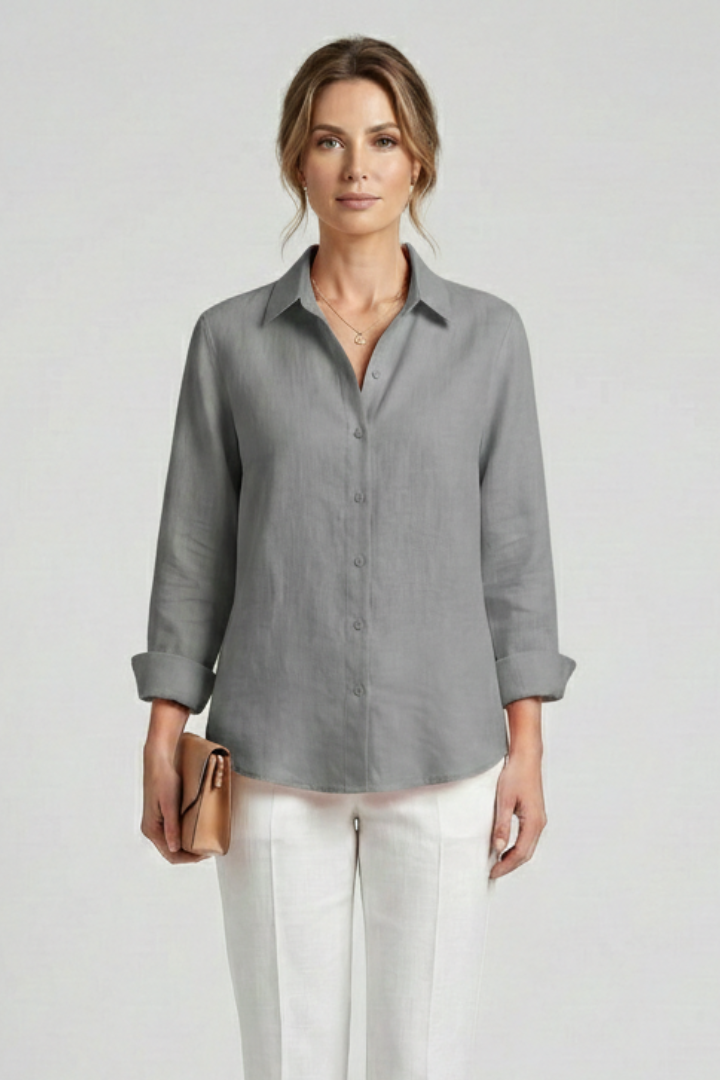 Women’s collared blouse with button fastening and roll-up sleeves, featuring a curved hem for everyday and work styling.