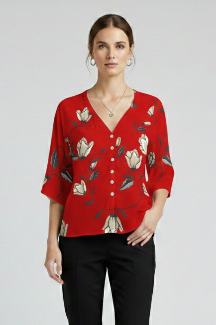 Women’s blouse with V-neckline and front button detailing, featuring short sleeves and floral print for everyday and casual styling.