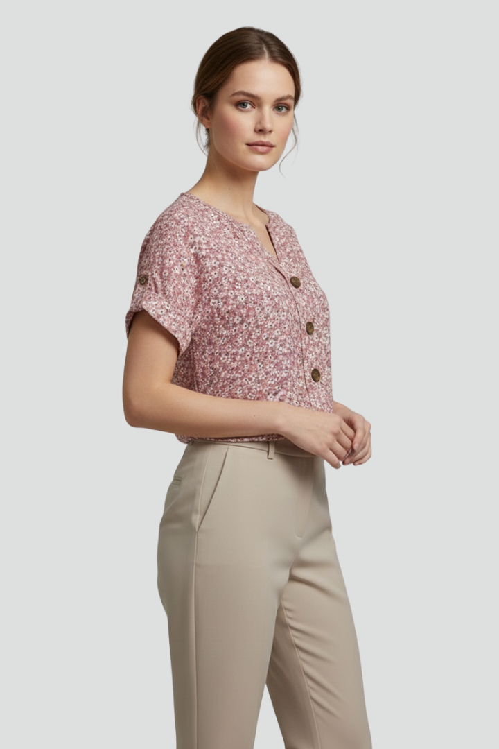 Women’s short sleeve blouse with round neckline, button front, printed surface, and straight hem for casual everyday styling.