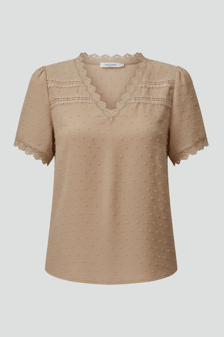 Women’s short sleeve blouse with V neckline, partial button fastening, and textured semi-sheer surface, suitable for office wear and everyday styling.
