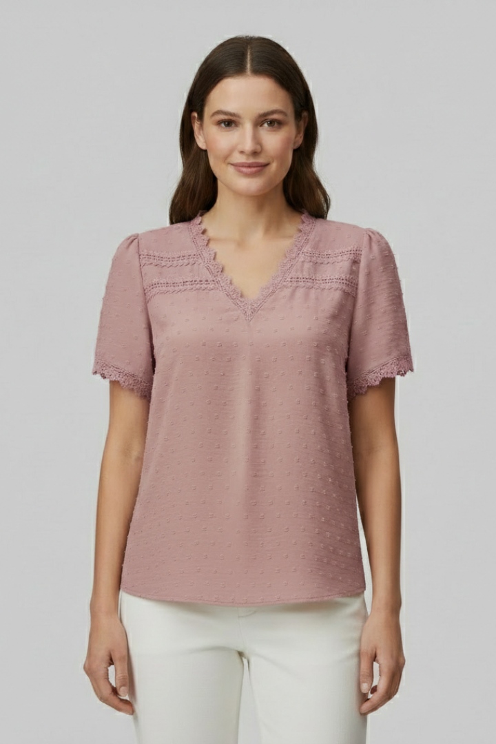 Women’s short sleeve blouse with V neckline, partial button fastening, and textured semi-sheer surface, suitable for office wear and everyday styling.