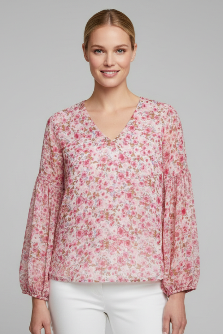 Women’s long sleeve blouse with V-neckline, elasticated cuffs, and all-over floral print, suitable for casual wear and everyday styling.