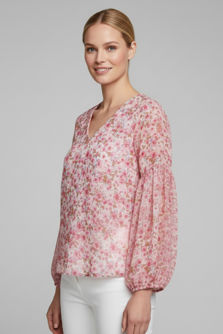 Women’s long sleeve blouse with V-neckline, elasticated cuffs, and all-over floral print, suitable for casual wear and everyday styling.
