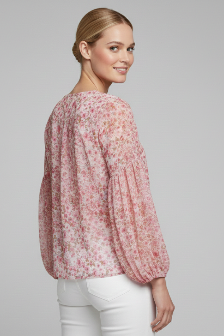 Women’s long sleeve blouse with V-neckline, elasticated cuffs, and all-over floral print, suitable for casual wear and everyday styling.