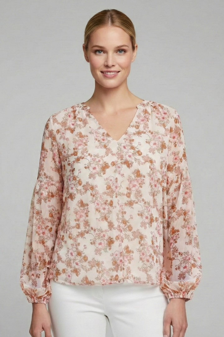 Women’s long sleeve blouse with V-neckline, elasticated cuffs, and all-over floral print, suitable for casual wear and everyday styling.