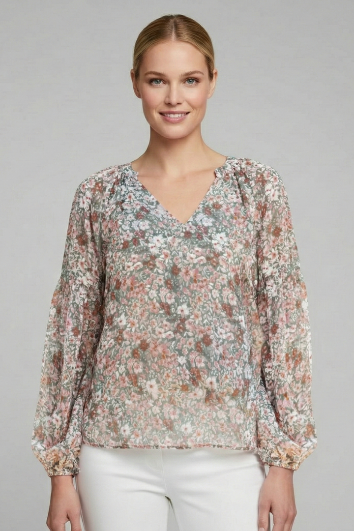 Women’s long sleeve blouse with V-neckline, elasticated cuffs, and all-over floral print, suitable for casual wear and everyday styling.