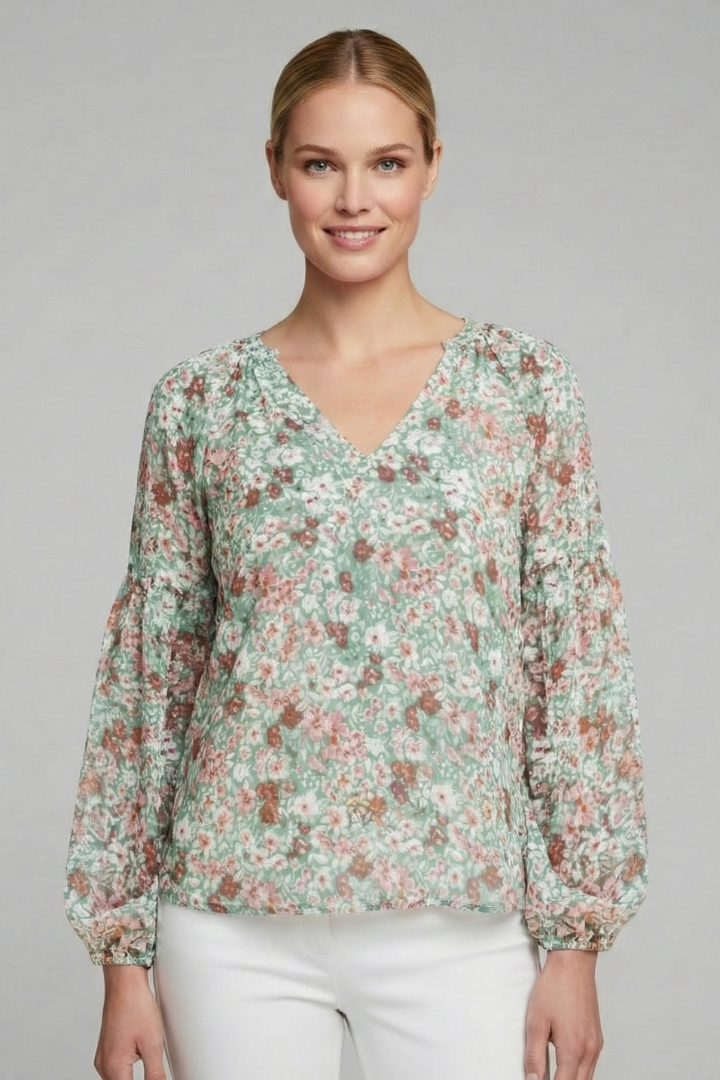 Women’s long sleeve blouse with V-neckline, elasticated cuffs, and all-over floral print, suitable for casual wear and everyday styling.