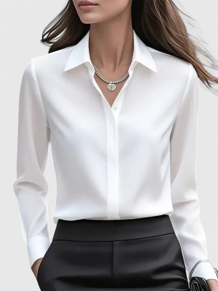 Women’s button front top with a collared neckline, curved hem, and relaxed fit, ideal for office wear and smart-casual outfits.