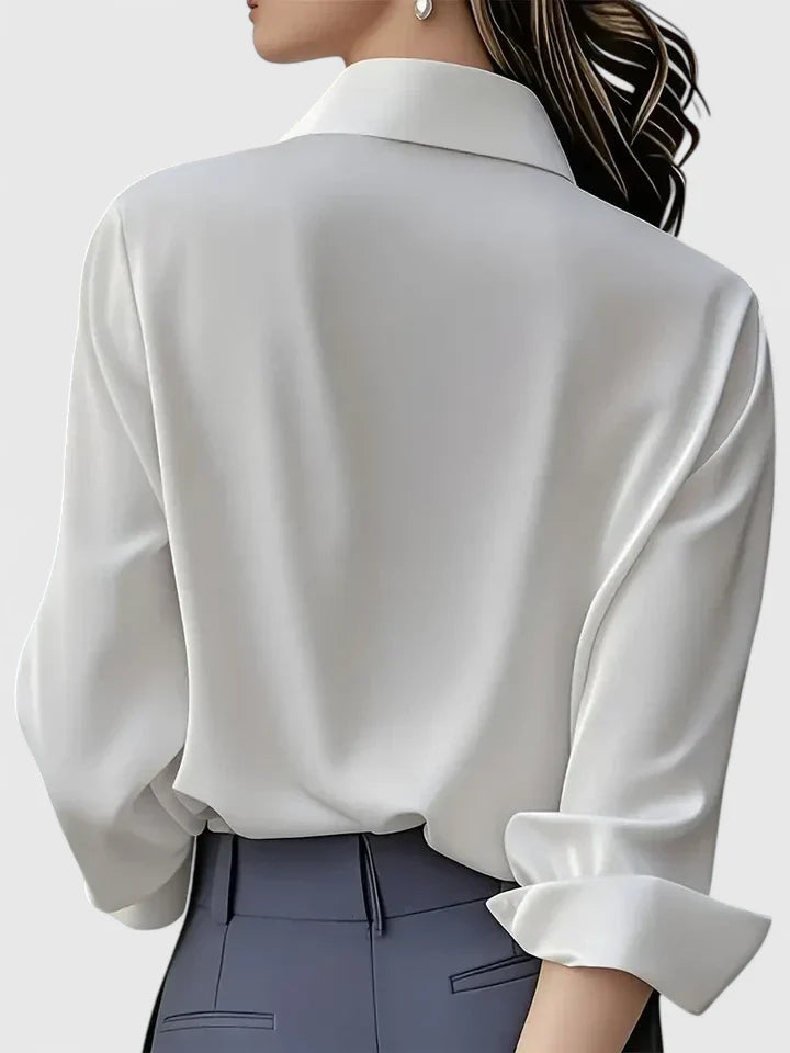Women’s button front top with a collared neckline, curved hem, and relaxed fit, ideal for office wear and smart-casual outfits.