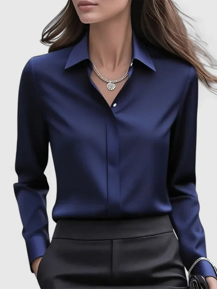 Women’s button front top with a collared neckline, curved hem, and relaxed fit, ideal for office wear and smart-casual outfits.