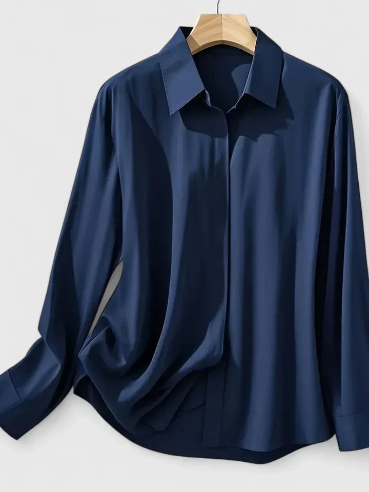 Women’s button front top with a collared neckline, curved hem, and relaxed fit, ideal for office wear and smart-casual outfits.