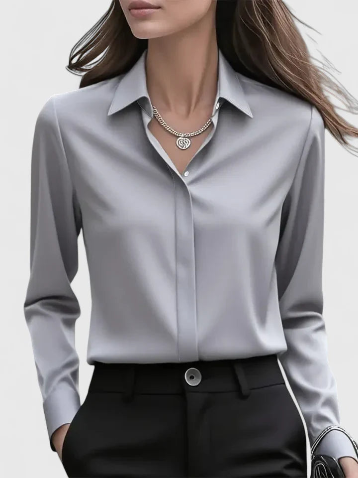 Women’s button front top with a collared neckline, curved hem, and relaxed fit, ideal for office wear and smart-casual outfits.