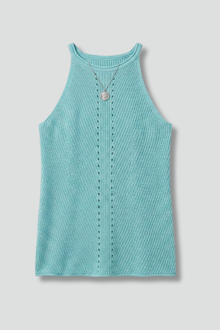 Women’s sleeveless top with round neckline, front button detail, and textured surface, suitable for casual wear and office outfits.