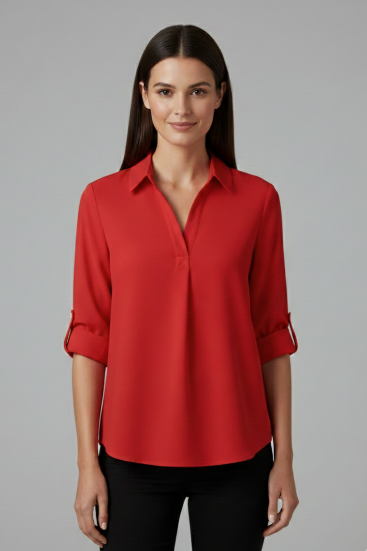 Women’s button-up blouse with collared neckline, long sleeves, and chest pocket, suitable for office wear and everyday styling.