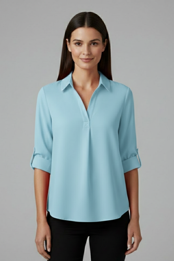 Women’s button-up blouse with collared neckline, long sleeves, and chest pocket, suitable for office wear and everyday styling.