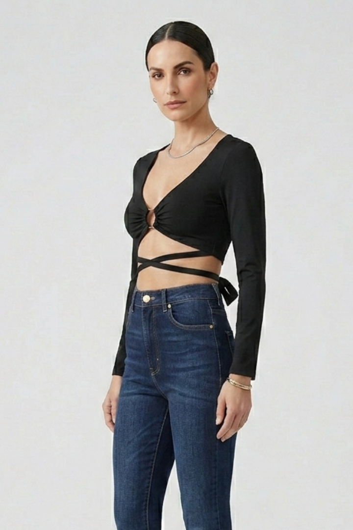 Women’s crop top with deep v-neckline, front ring detail, and wrap straps, ideal for party outfits and casual evening styling.