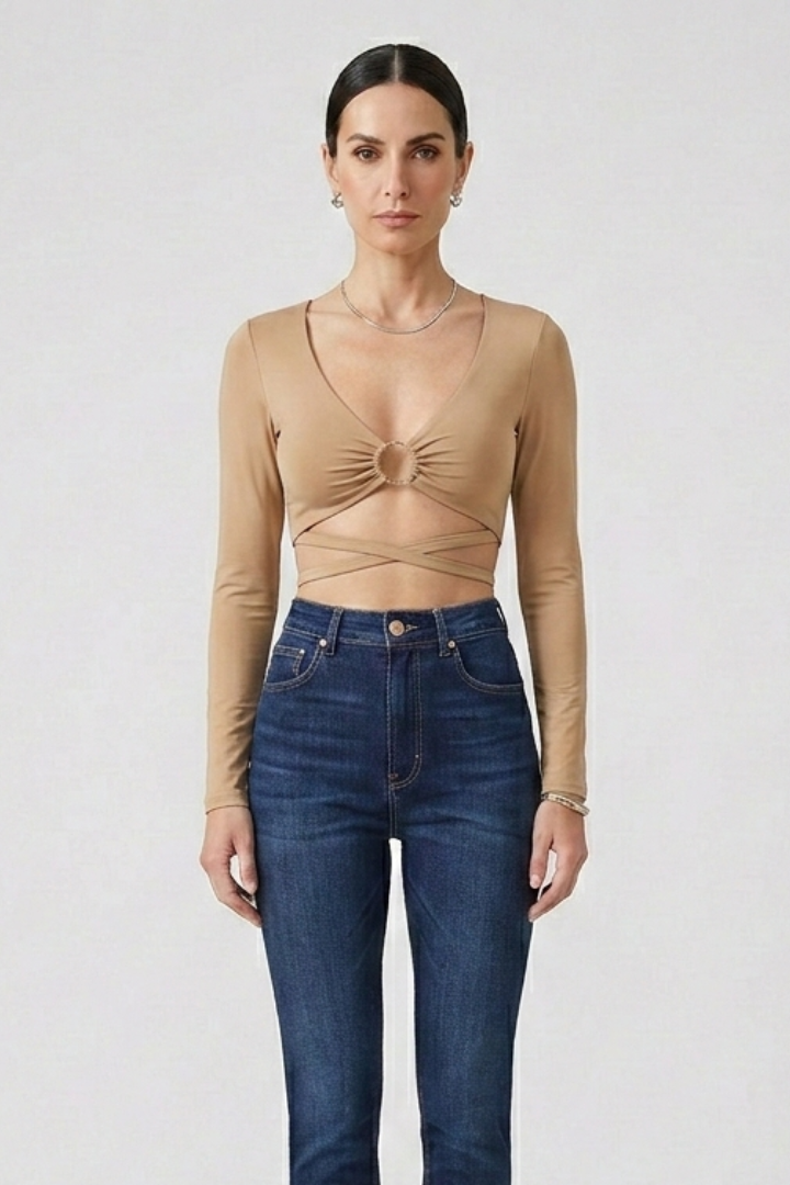 Women’s crop top with deep v-neckline, front ring detail, and wrap straps, ideal for party outfits and casual evening styling.
