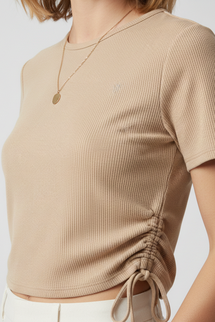 Women’s cropped T-shirt with side ruching and adjustable tie detail, designed for casual wear and modern styling.