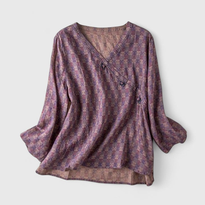 Women’s embroidered blouse with roll-tab sleeves and a relaxed fit, suitable for office outfits, casual wear, and everyday styling.