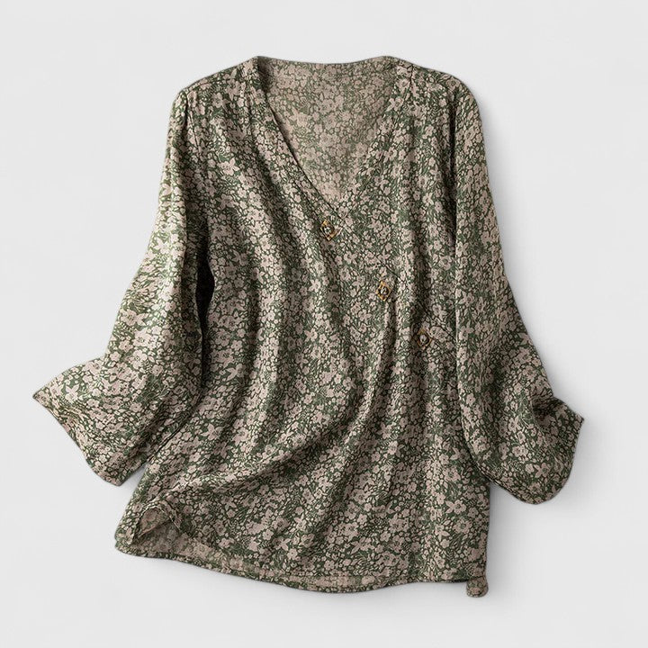 Women’s embroidered blouse with roll-tab sleeves and a relaxed fit, suitable for office outfits, casual wear, and everyday styling.