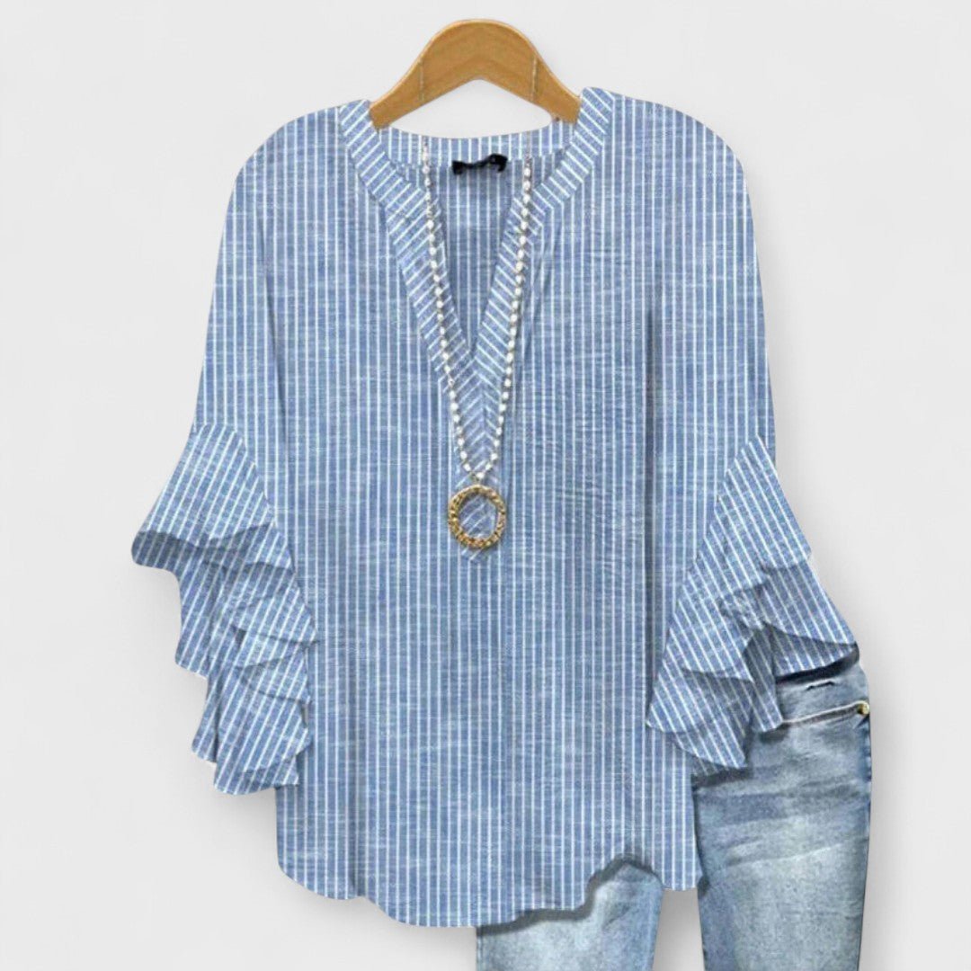 Women’s floral blouse with ruffle sleeves, V-neckline, and relaxed fit, suitable for office wear, casual outings, and everyday styling.
