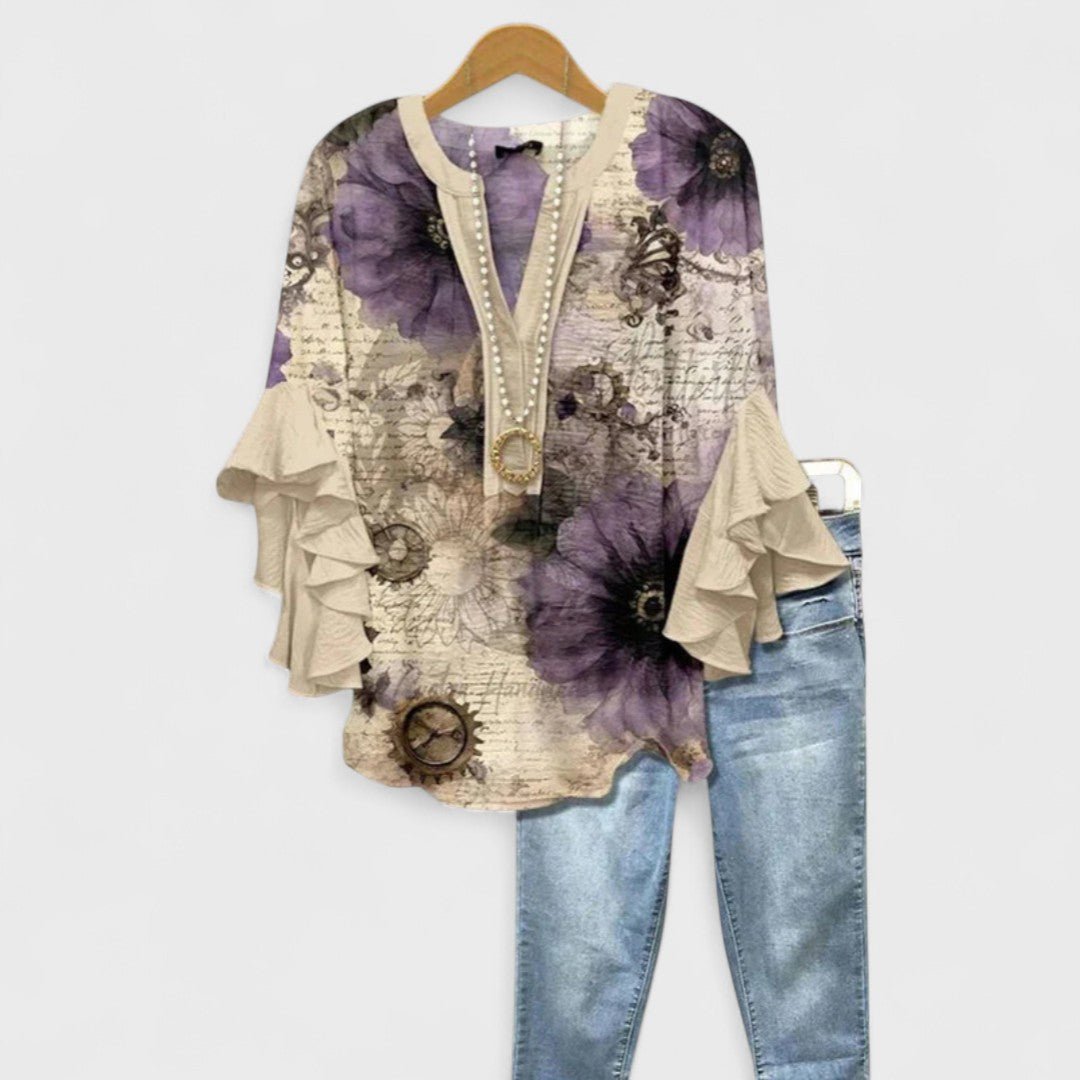 Women’s floral blouse with ruffle sleeves, V-neckline, and relaxed fit, suitable for office wear, casual outings, and everyday styling.