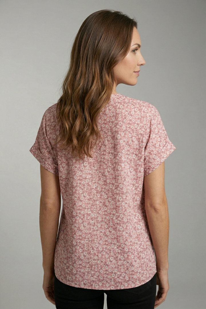Women’s floral blouse with round neckline, button front, and short sleeves, ideal for casual outfits and everyday fashion styling.