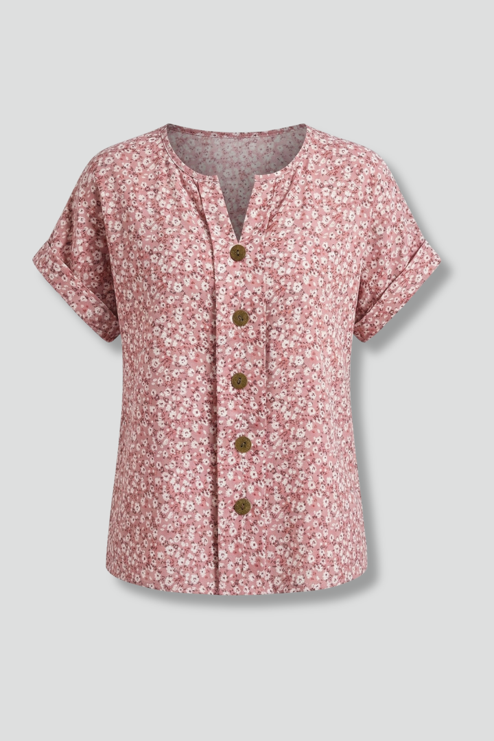 Women’s floral blouse with round neckline, button front, and short sleeves, ideal for casual outfits and everyday fashion styling.
