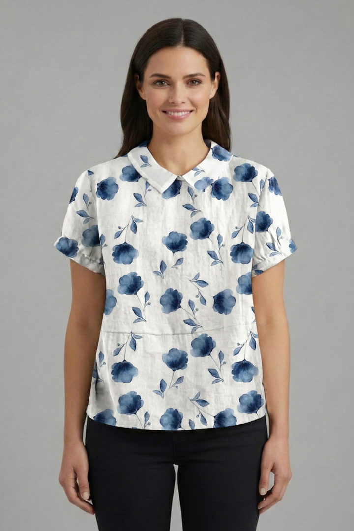 Women’s short sleeve blouse with collared neckline and floral print, featuring a relaxed fit and textured surface for everyday and office wear.