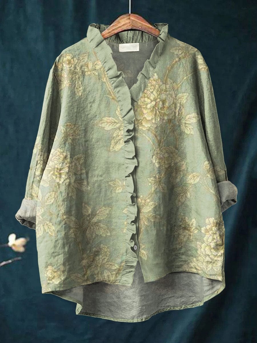 Women’s floral blouse with ruffle neckline, high-low hem, vintage floral print, and relaxed fit, suitable for brunch outings and everyday styling.