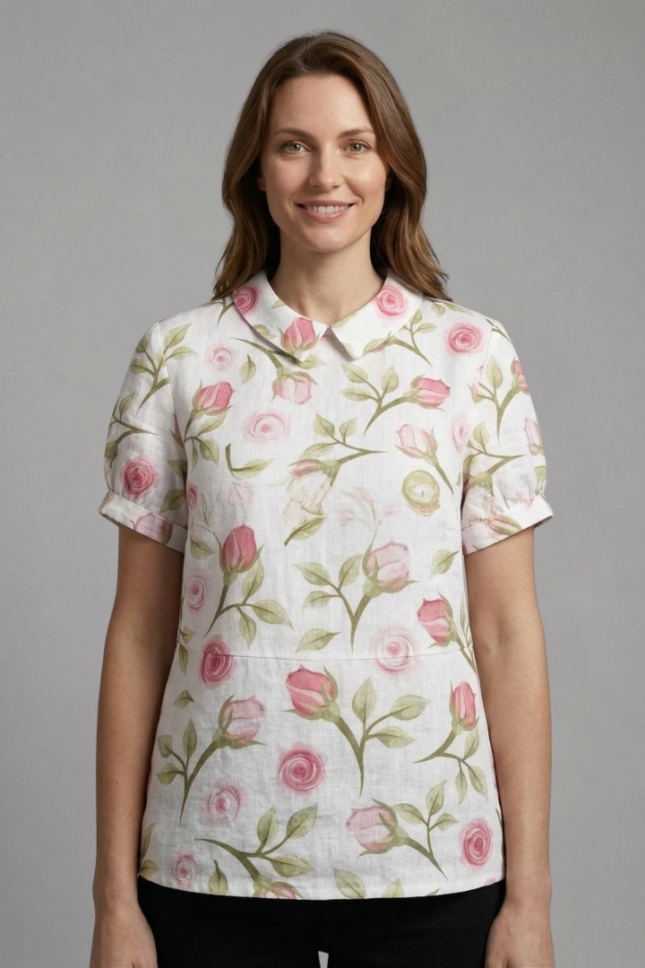 Women’s floral blouse with notch neckline and short sleeves, ideal for casual outfits and smart everyday styling.