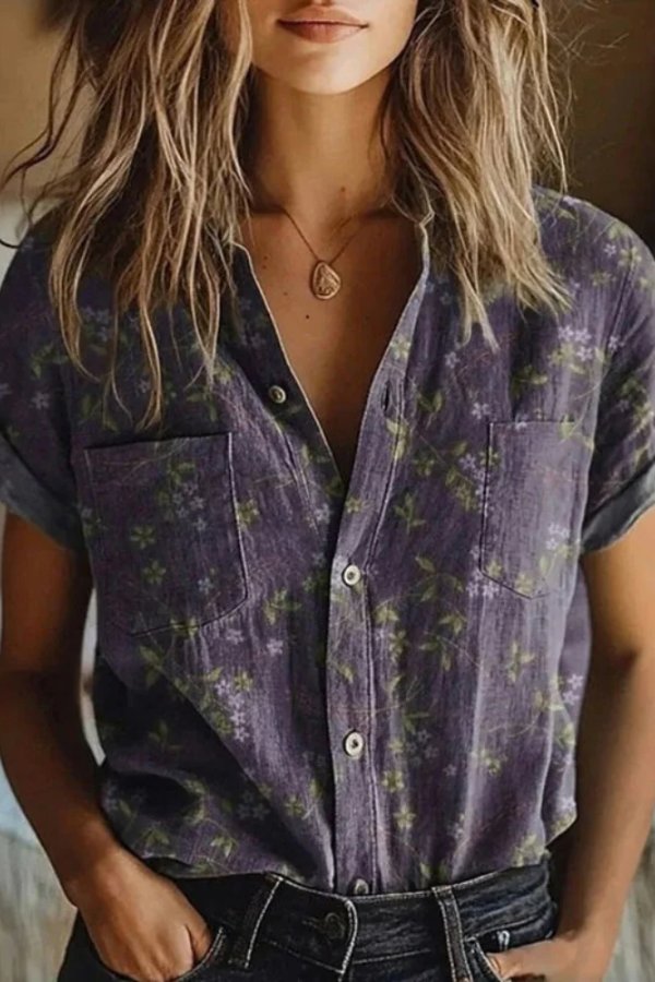 Women’s floral blouse with button closure, short sleeves, and relaxed fit, suitable for office wear, casual outings, and everyday styling.