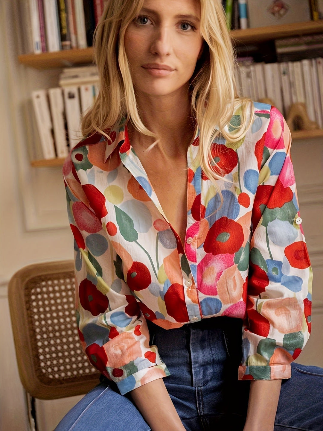 Women’s floral blouse with a button front, watercolor print, and relaxed fit, suitable for casual outfits, office wear, and smart occasions.