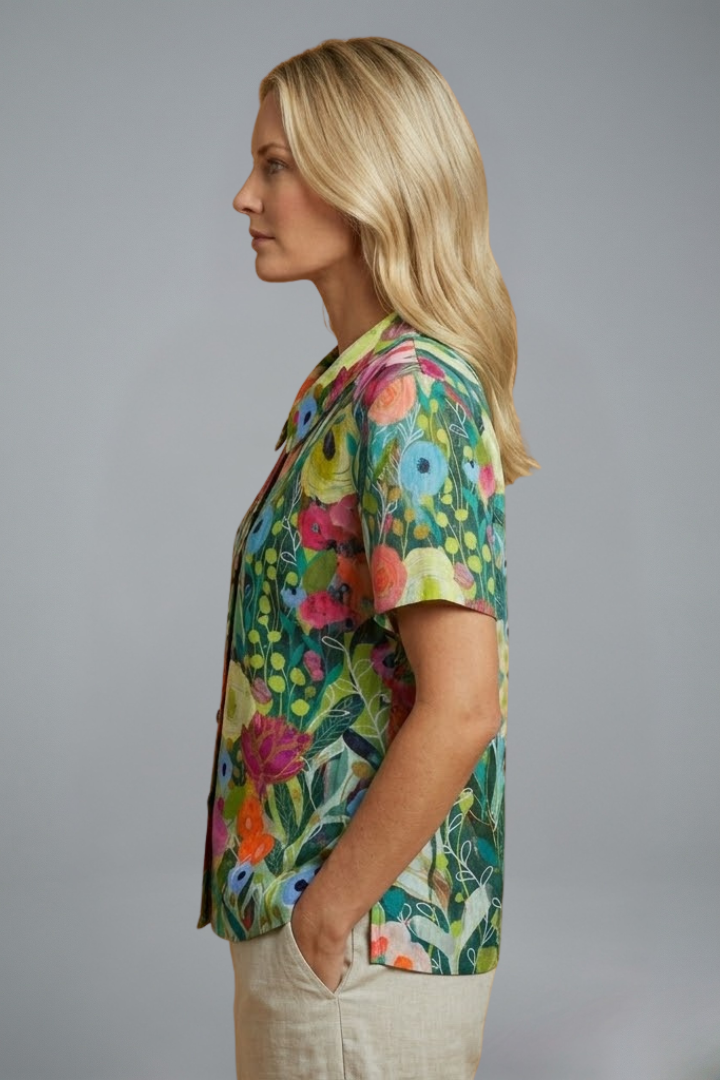 Women’s floral blouse with round neckline, short sleeves, relaxed fit, and straight hem for casual everyday styling.