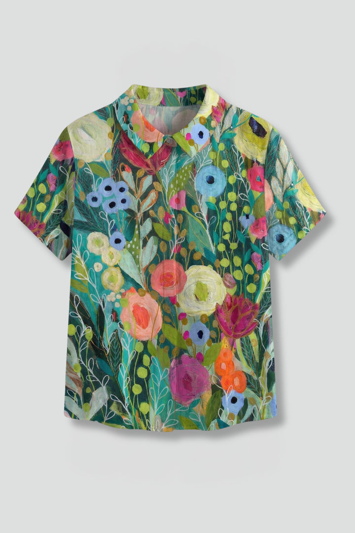 Women’s floral blouse with round neckline, short sleeves, relaxed fit, and straight hem for casual everyday styling.