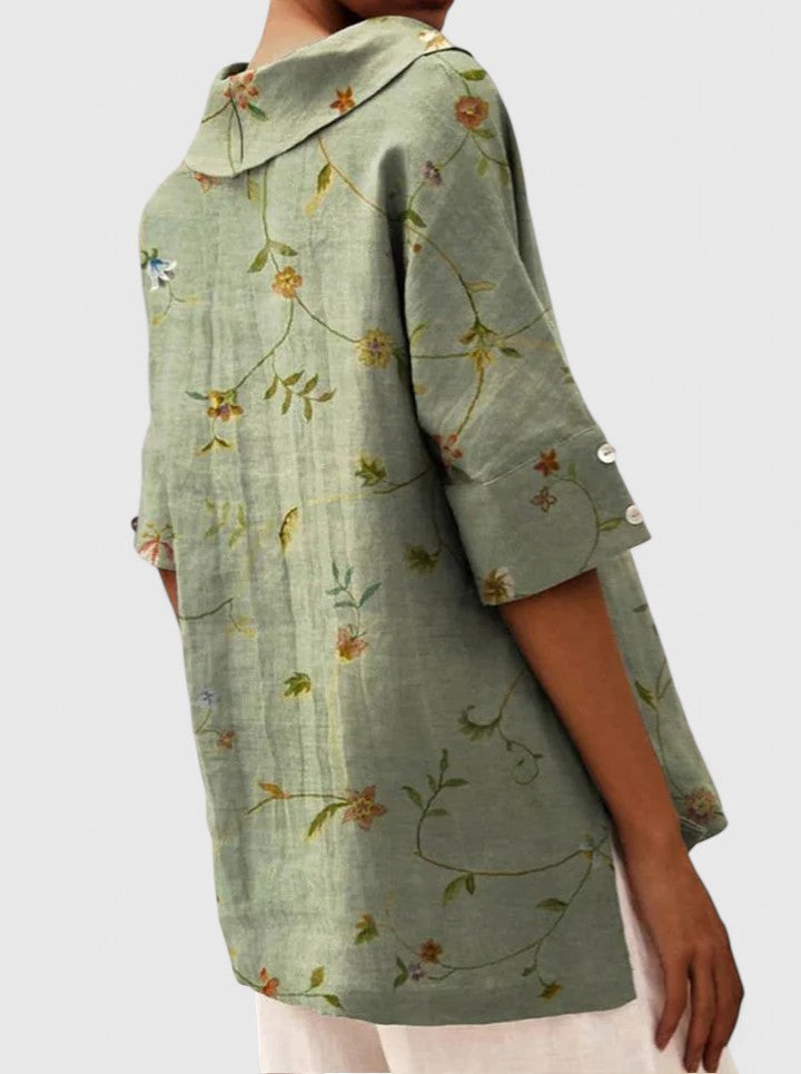 Women’s floral top with a V-neckline and relaxed fit, ideal for spring and summer outings, casual wear, and smart-casual styling.
