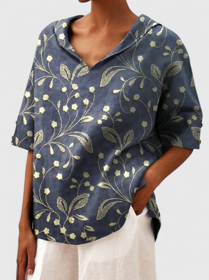 Women’s floral top with a V-neckline and relaxed fit, ideal for spring and summer outings, casual wear, and smart-casual styling.
