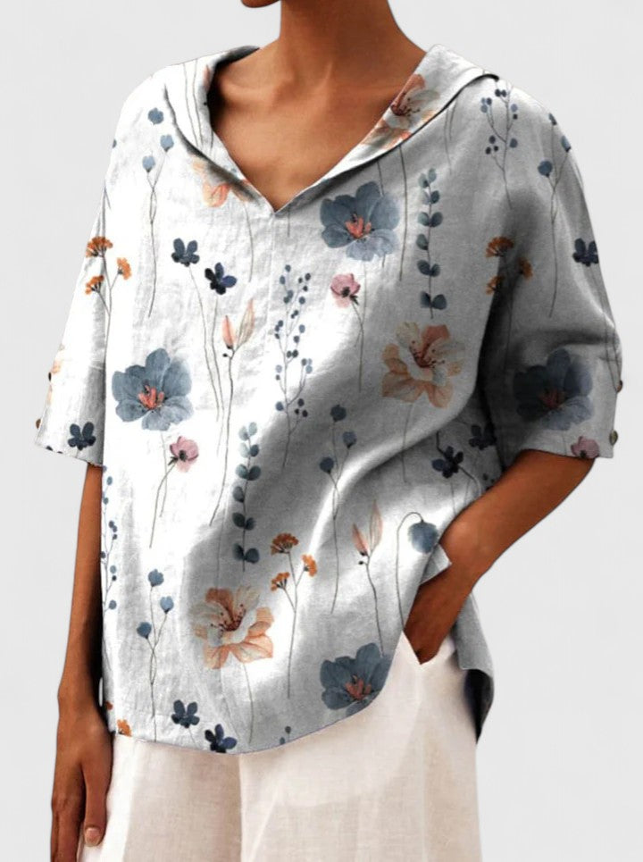 Women’s floral top with a V-neckline and relaxed fit, ideal for spring and summer outings, casual wear, and smart-casual styling.