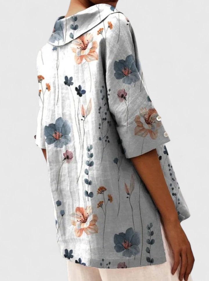 Women’s floral top with a V-neckline and relaxed fit, ideal for spring and summer outings, casual wear, and smart-casual styling.