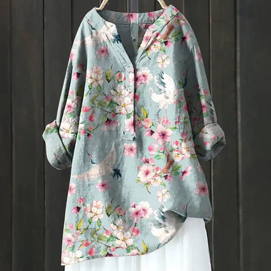 Women’s floral tunic top with button-up front, long sleeves, and relaxed fit, suitable for casual outings, travel, and everyday wear.