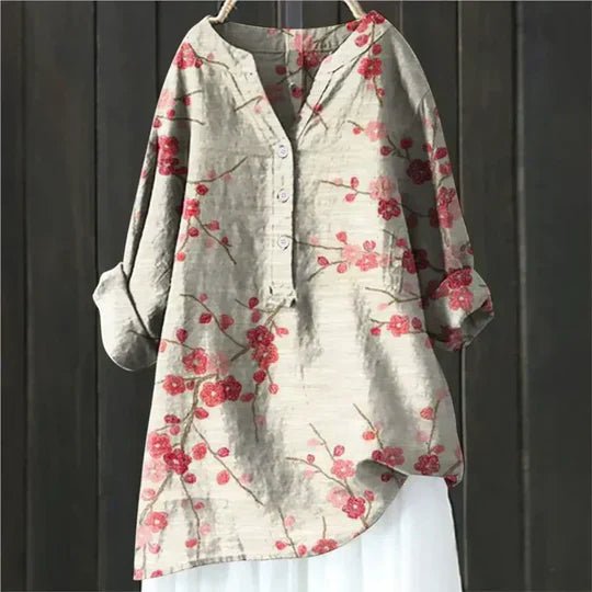 Women’s floral tunic top with button-up front, long sleeves, and relaxed fit, suitable for casual outings, travel, and everyday wear.