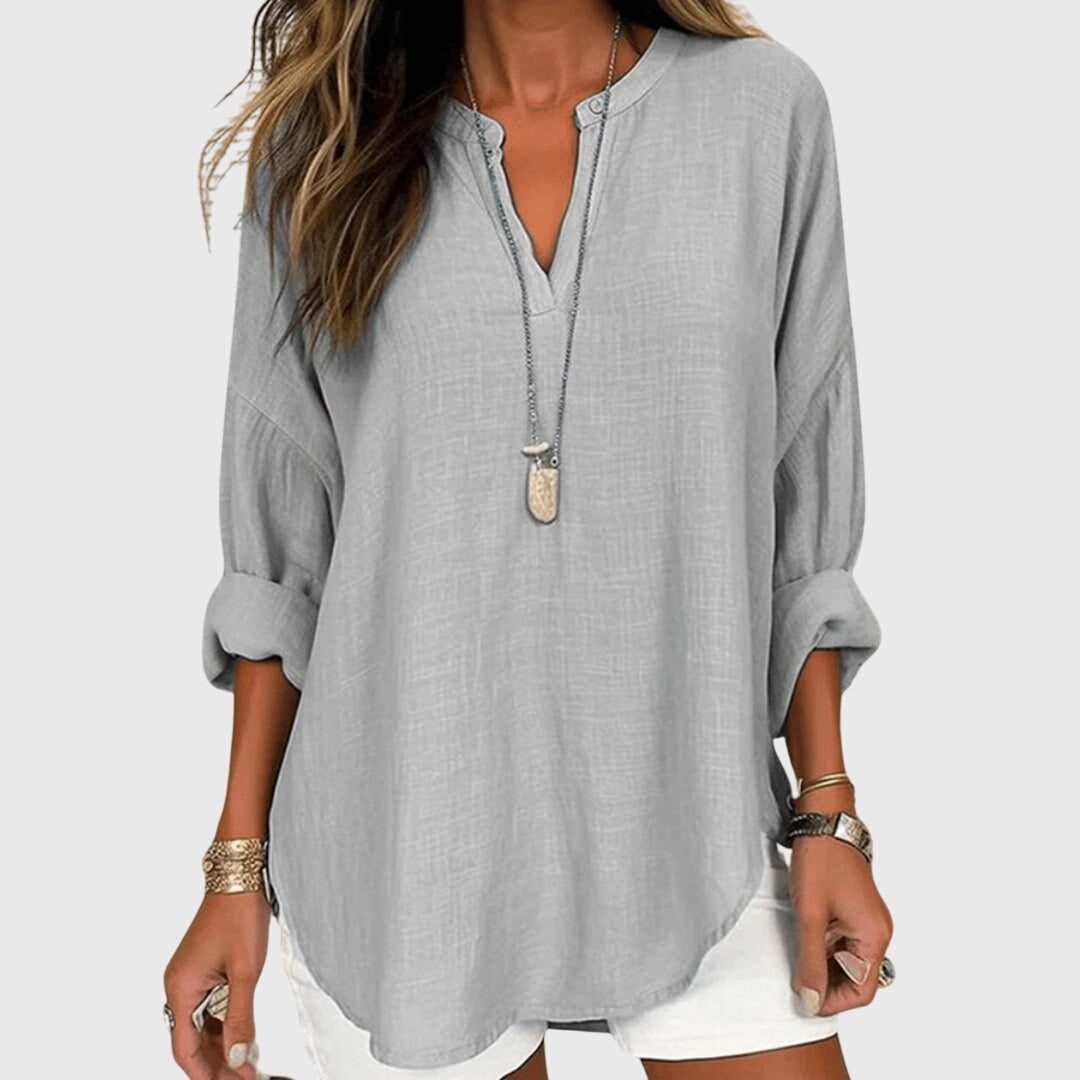 Women’s flowy beach shirt with round neck and long sleeves, ideal for beach vacations, casual summer outfits, and lightweight layering.