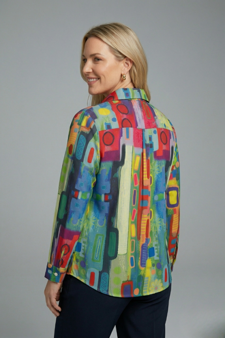 Women’s geometric print blouse with button-front closure, long sleeves, and collar neckline for office and casual everyday outfits.