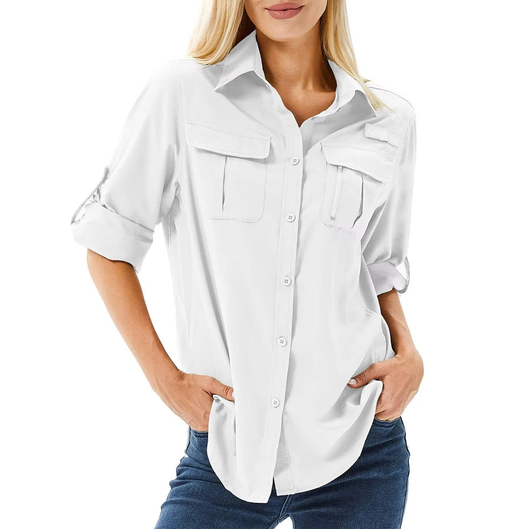 Women’s hiking shirt with roll-up sleeves, chest pockets, UPF 50 protection, and relaxed fit, suitable for hiking, camping, and outdoor activities.
