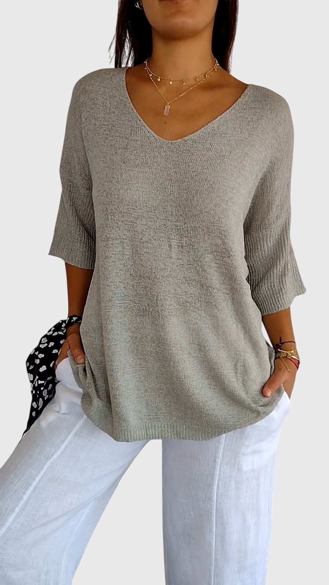 Women’s knit top with V-neckline and soft fit, ideal for layering, casual outfits, office wear, and everyday styling.