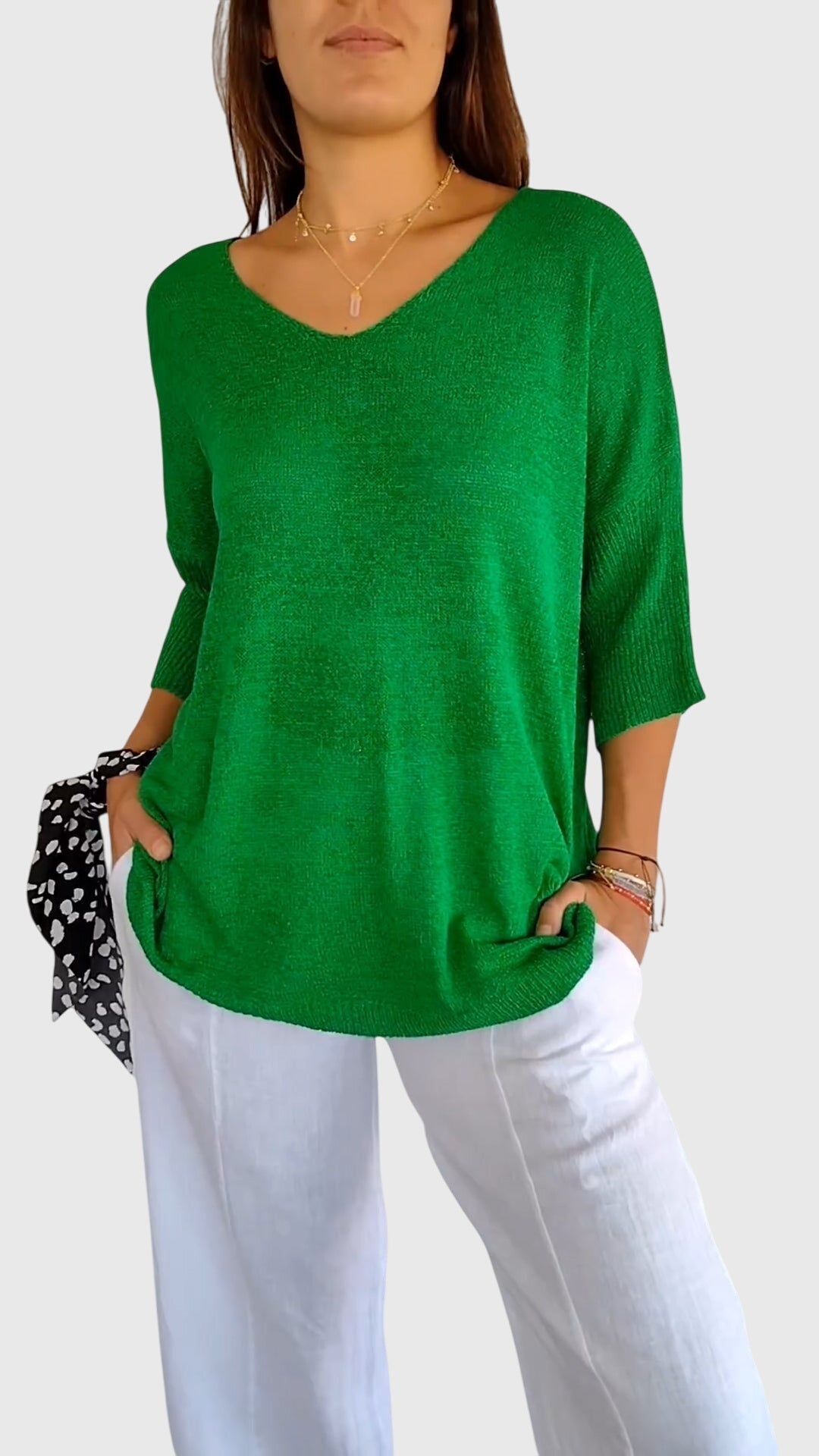 Women’s knit top with V-neckline and soft fit, ideal for layering, casual outfits, office wear, and everyday styling.