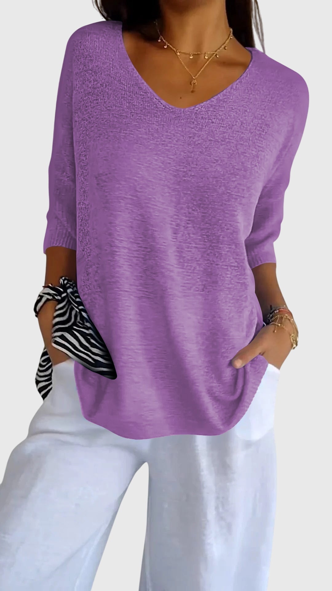 Women’s knit top with V-neckline and soft fit, ideal for layering, casual outfits, office wear, and everyday styling.